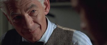 Movie still from “Gods and Monsters” (1998), directed by Bill Condon – An older man wearing a sweater and a tie; Close Up shot, Over the shoulder angle