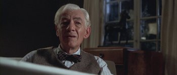 Movie still from “Gods and Monsters” (1998), directed by Bill Condon – An older man wearing a vest and bow tie; Close Up shot, Low angle