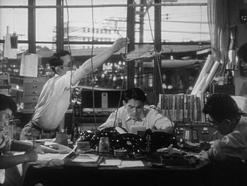 Movie still from “Godzilla: King of the Monsters!” (1956), directed by Ishirô Honda – Two men working in an electronics factory; Medium shot, Low angle