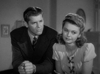 Movie still from “Going My Way” (1944), directed by Leo McCarey – A man and a woman sitting next to each other; Close Up shot, High angle