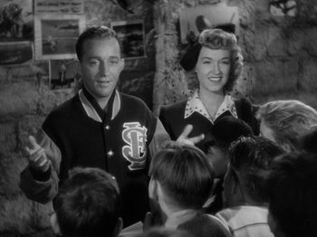 Movie still from “Going My Way” (1944), directed by Leo McCarey – A man and a woman standing next to each other; Medium shot, Over the shoulder angle