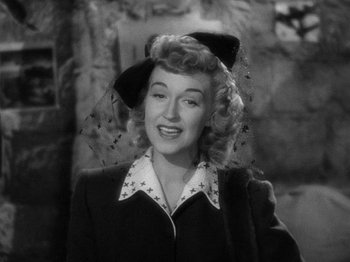 Movie still from “Going My Way” (1944), directed by Leo McCarey – An old photo of a woman wearing a hat; Close Up shot, High angle