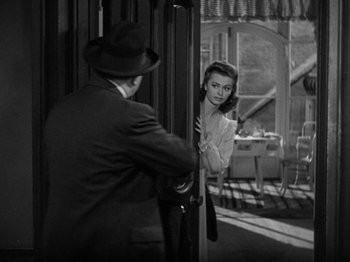 Movie still from “Going My Way” (1944), directed by Leo McCarey – An old photo of a man and a woman looking in the same mirror; Medium shot, Over the shoulder angle