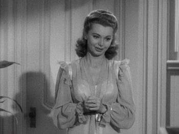 Movie still from “Going My Way” (1944), directed by Leo McCarey – A black and white photo of a woman in a nightgown; Close Up shot, Over the shoulder angle