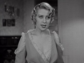 Movie still from “Gold Diggers of 1933” (1933), directed by Mervyn LeRoy – A black - and - white photo of a woman in a dress; Close Up shot, High angle