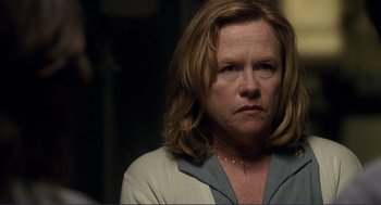 Movie still from “Gone Baby Gone” (2007), directed by Ben Affleck – A person wearing a white shirt; Close Up shot, Over the shoulder angle