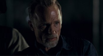 Movie still from “Gone Baby Gone” (2007), directed by Ben Affleck – An older man with a beard and a mustache; Close Up shot, Over the shoulder angle