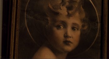 Movie still from “Gone Baby Gone” (2007), directed by Ben Affleck – An image of a young girl with a hat on her head; Extreme Close Up shot, Overhead angle