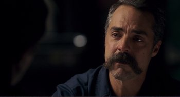 Movie still from “Gone Baby Gone” (2007), directed by Ben Affleck – A person with a mustache; Close Up shot, Over the shoulder angle