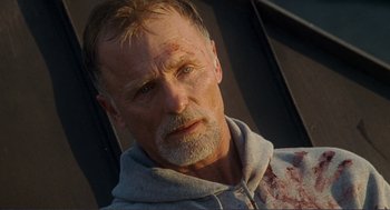 Movie still from “Gone Baby Gone” (2007), directed by Ben Affleck – A person wearing a hooded sweatshirt; Close Up shot, Low angle