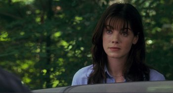 Movie still from “Gone Baby Gone” (2007), directed by Ben Affleck – A woman sitting in the back seat of a car; Close Up shot, Over the shoulder angle