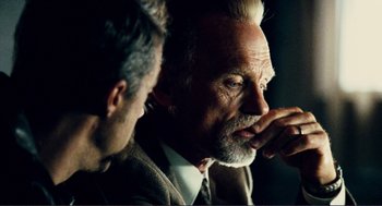 Movie still from “Gone Baby Gone” (2007), directed by Ben Affleck – A man with a gray beard is looking at another man; Close Up shot, Over the shoulder angle