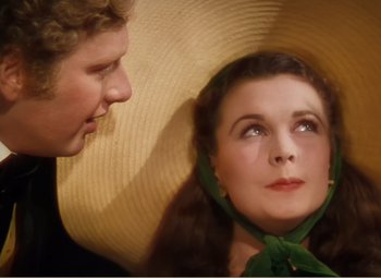 Movie still from “Gone with the Wind” (1939), directed by George Cukor – A man and a woman are looking at one another; Close Up shot, Over the shoulder angle