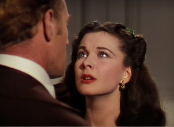 Movie still from “Gone with the Wind” (1939), directed by George Cukor – A man and a woman looking at one another; Close Up shot, Low angle