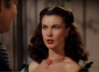 Movie still from “Gone with the Wind” (1939), directed by George Cukor – A person wearing a necklace; Close Up shot, Over the shoulder angle