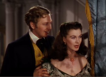 Movie still from “Gone with the Wind” (1939), directed by George Cukor – A man standing next to a beautiful woman; Close Up shot, Over the shoulder angle