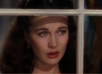 Movie still from “Gone with the Wind” (1939), directed by George Cukor – A person looking through a window; Close Up shot, Over the shoulder angle