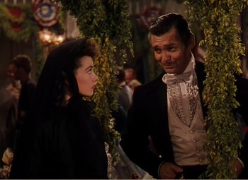 Movie still from “Gone with the Wind” (1939), directed by George Cukor – A man and a woman standing next to each other; Medium shot, High angle