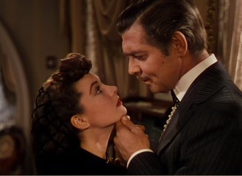Movie still from “Gone with the Wind” (1939), directed by George Cukor – A man and a woman are looking into each others eyes; Close Up shot, High angle