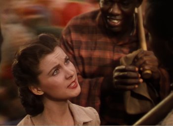 Movie still from “Gone with the Wind” (1939), directed by George Cukor – A woman and a man are looking at each other; Close Up shot, High angle
