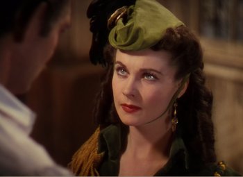 Movie still from “Gone with the Wind” (1939), directed by George Cukor – A person wearing a hat; Close Up shot, Over the shoulder angle