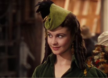 Movie still from “Gone with the Wind” (1939), directed by George Cukor – A person wearing a hat with a bird on it; Close Up shot, Over the shoulder angle