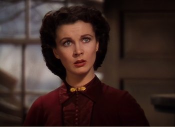 Movie still from “Gone with the Wind” (1939), directed by George Cukor – A person wearing a red shirt; Close Up shot, Over the shoulder angle
