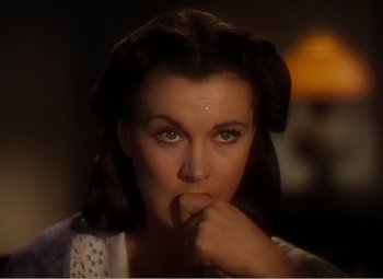 Movie still from “Gone with the Wind” (1939), directed by George Cukor – A person holding their finger to her mouth; Close Up shot, High angle