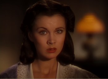 Movie still from “Gone with the Wind” (1939), directed by George Cukor – A person wearing a white shirt; Close Up shot, High angle