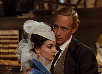 Movie still from “Gone with the Wind” (1939), directed by George Cukor – A man and a woman standing next to each other; Close Up shot, High angle