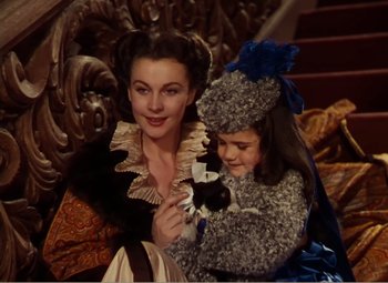 Movie still from “Gone with the Wind” (1939), directed by George Cukor – A woman and a child dressed in costumes; Close Up shot, High angle