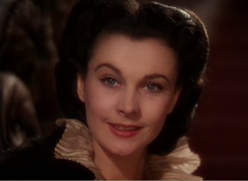 Movie still from “Gone with the Wind” (1939), directed by George Cukor – A woman's face in a black dress; Close Up shot, High angle