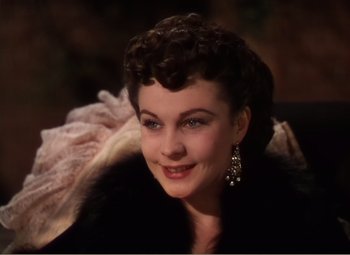 Movie still from “Gone with the Wind” (1939), directed by George Cukor – A person wearing a suit and tie; Close Up shot, Over the shoulder angle