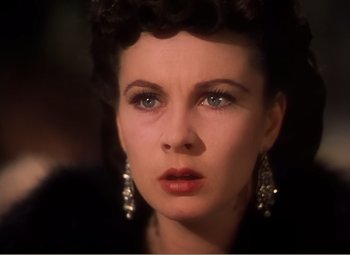 Movie still from “Gone with the Wind” (1939), directed by George Cukor – A person wearing a black jacket; Close Up shot, High angle