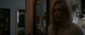 Movie still from “Graduation” (2016), directed by Cristian Mungiu – A woman standing in front of a bathroom mirror; Close Up shot, Over the shoulder angle