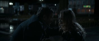 Movie still from “Graduation” (2016), directed by Cristian Mungiu – A man and a woman in the dark touching hands; Close Up shot, Over the shoulder angle