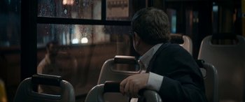 Movie still from “Graduation” (2016), directed by Cristian Mungiu – A man sitting on a bus looking out the window; Close Up shot, Over the shoulder angle