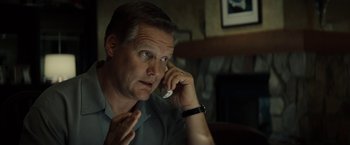 Movie still from “Gran Torino” (2008), directed by Clint Eastwood – A person talking on a cell phone; Close Up shot, Low angle