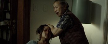 Movie still from “Gran Torino” (2008), directed by Clint Eastwood – Medium shot, Low angle