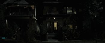 Movie still from “Gran Torino” (2008), directed by Clint Eastwood – A house with a lot of lights in the dark; Wide shot, Low angle