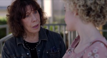 Movie still from “Grandma” (2015), directed by Paul Weitz – A woman talking to another woman on a porch; Close Up shot, Over the shoulder angle