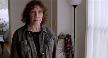 Movie still from “Grandma” (2015), directed by Paul Weitz – An older woman standing in front of a mirror; Close Up shot, Over the shoulder angle