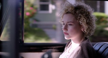Movie still from “Grandma” (2015), directed by Paul Weitz – A woman sitting in a car looking out the window; Close Up shot, Over the shoulder angle
