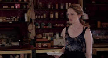 Movie still from “Grandma” (2015), directed by Paul Weitz – A woman holding a white plate in her hand; Medium shot, Over the shoulder angle