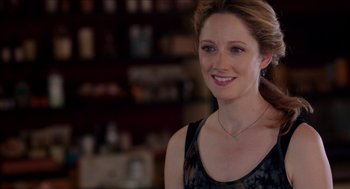 Movie still from “Grandma” (2015), directed by Paul Weitz – A beautiful woman with long blonde hair wearing a black top; Close Up shot, Over the shoulder angle