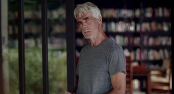 Movie still from “Grandma” (2015), directed by Paul Weitz – An older man with white hair is standing in front of a window; Close Up shot, Low angle