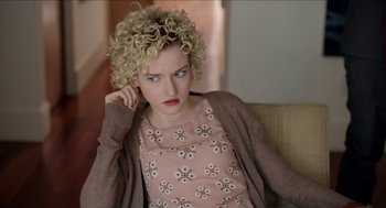 Movie still from “Grandma” (2015), directed by Paul Weitz – A woman sitting on a couch with her hand in her ear; Close Up shot, Over the shoulder angle