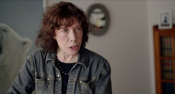 Movie still from “Grandma” (2015), directed by Paul Weitz – A woman in a black shirt and a jean jacket; Close Up shot, Over the shoulder angle