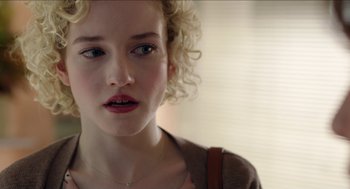 Movie still from “Grandma” (2015), directed by Paul Weitz – A person with curly blonde hair; Close Up shot, Over the shoulder angle