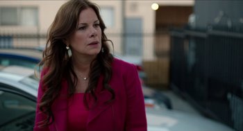 Movie still from “Grandma” (2015), directed by Paul Weitz – A person wearing a suit and tie; Close Up shot, Over the shoulder angle